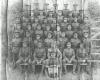 No5 Platoon, 128th Battalion. George Ridgeway seated 5th row from the front, second from the left.