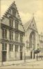 Postcard featuring a church from Ypres, Belgium.
In Dutch,it states "Voorgevel van het Godshuis Belle" (Frontage of a beautiful church).