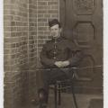 Pte. William McLeish in uniform, sitting, taken at German P.O.W. Camp Rennbahn, 1916, WWI