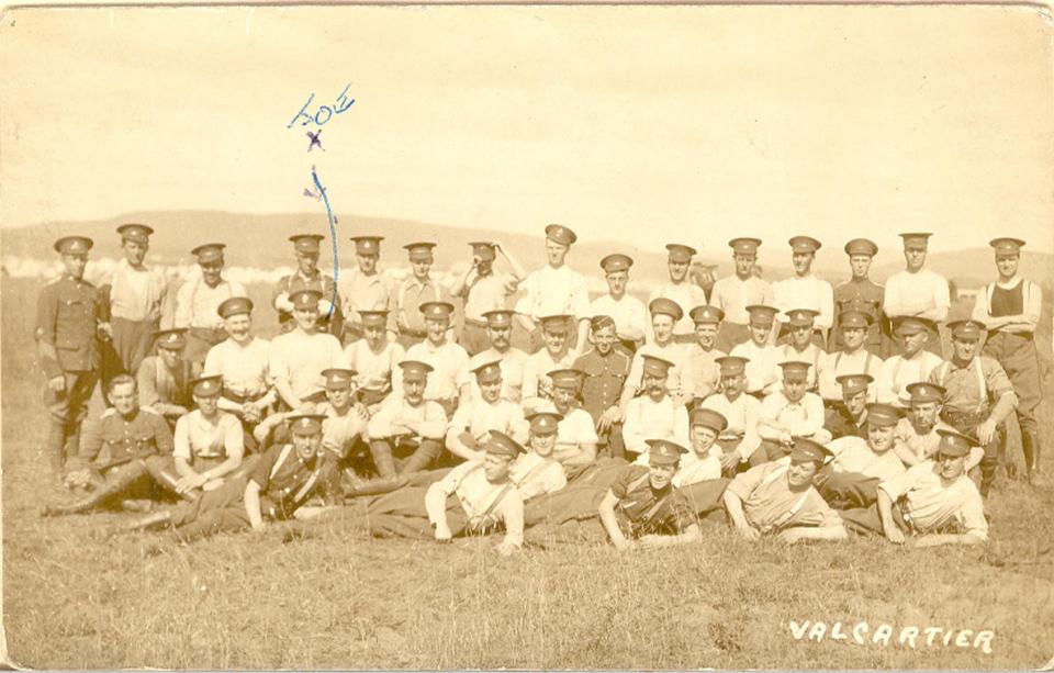 Postcard of soldiers on the grass at Valcartier, north of Quebec City.