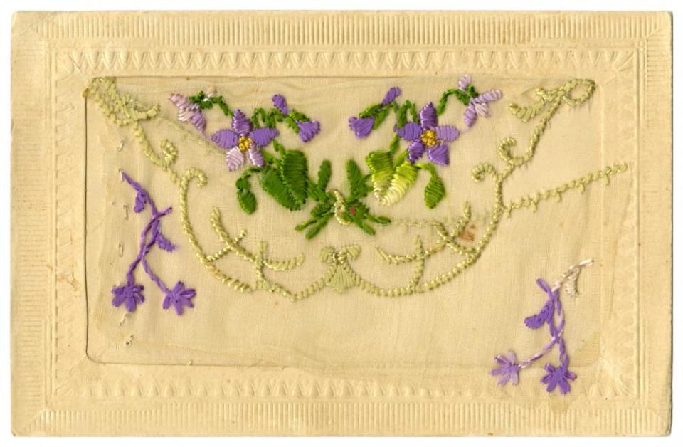 #06-front-pocket-empty: Souvenir silk postcard, November 1915, including a small card enclosed in the silk pocket with message “Greetings from France.” It was mailed along with lace edged handkerchief. Shown here with front pocket empty.