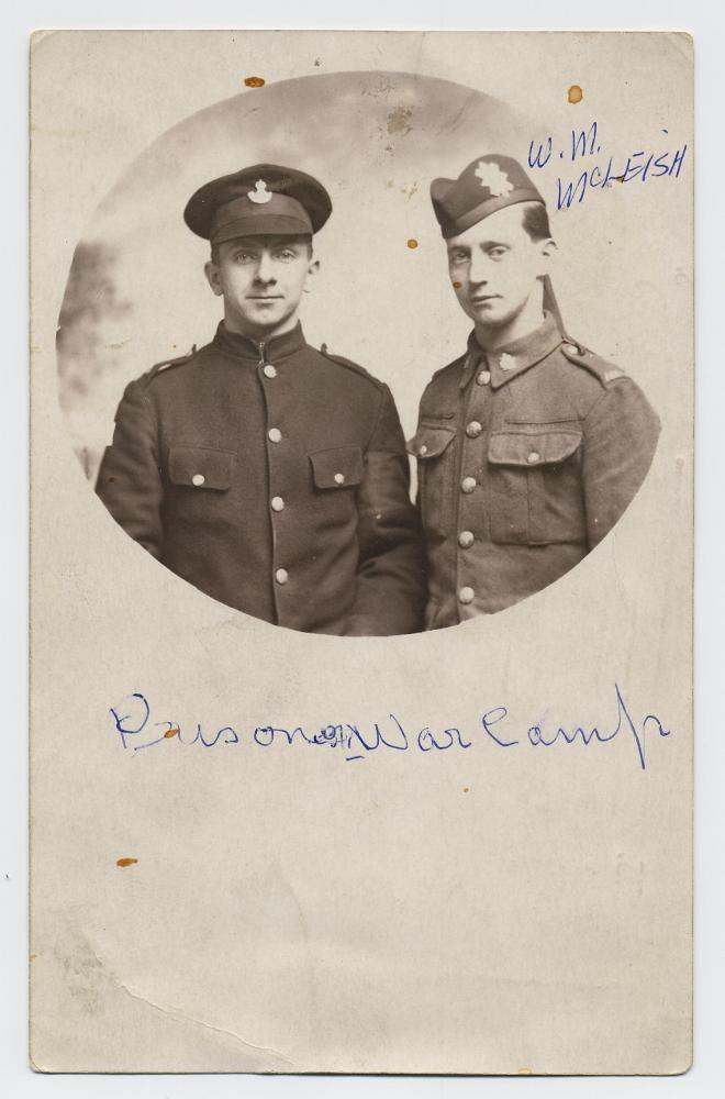 William McLeish with unidenified soldier wearing P.O.W. armband, date unknown, WWI